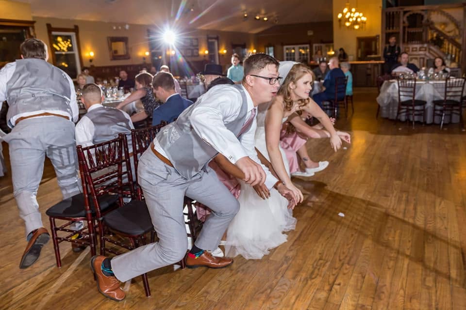 Wedding party joining a lively reception dance